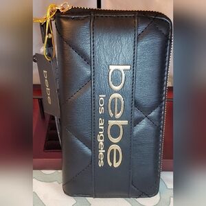 Bebe Black Zippered Wallet with Gold Accents. NWT